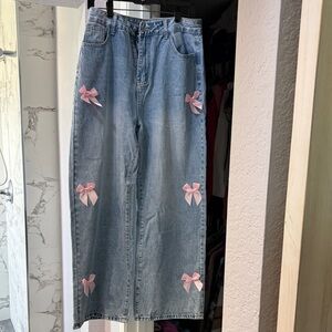 Light Blue Wide-Leg Jeans with Pink Bow Accents